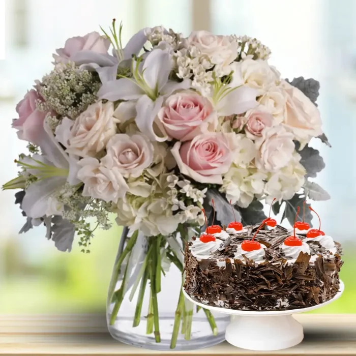 lilies-roses-alstroemeria-and-hydrangeas-in-vase-with-cake
