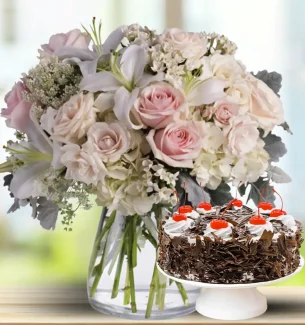 lilies-roses-alstroemeria-and-hydrangeas-in-vase-with-cake